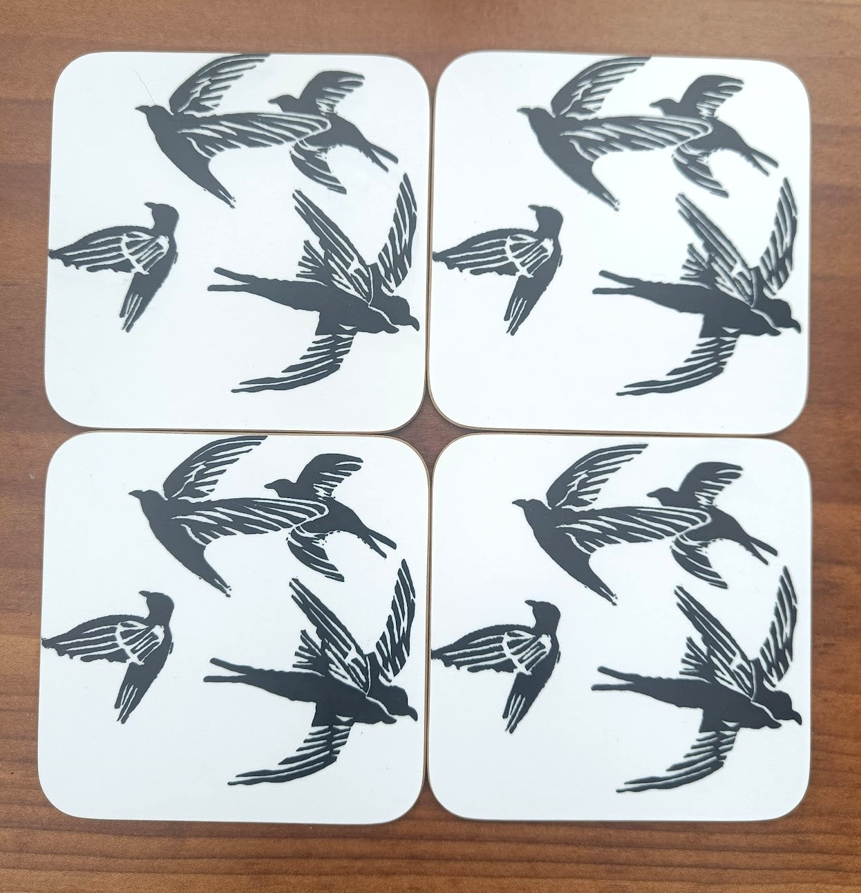 4 Circling Swift Square Coasters